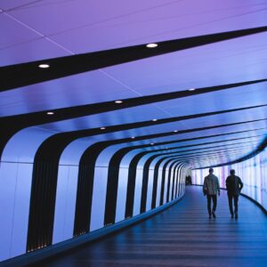 man walking through pathway