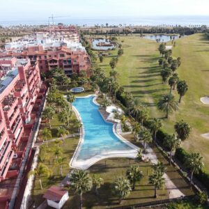 an aerial view of a golf course and a resort